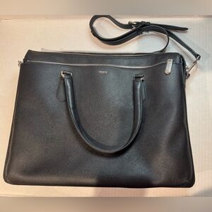 NWOT TUMI Black Leather Bag with Silver hardware. Exterior pockets.